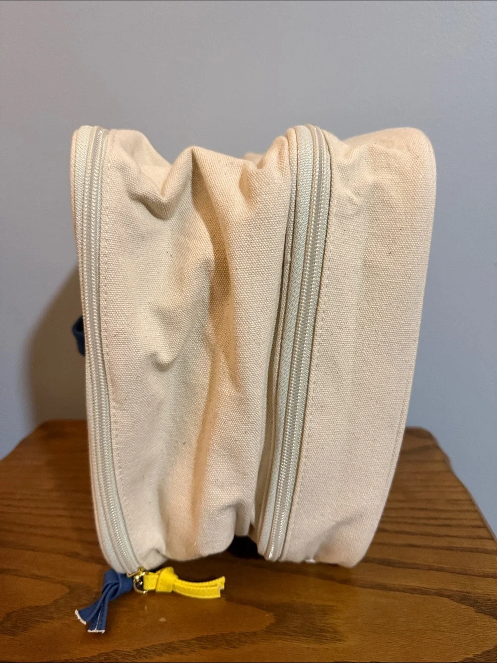 Chloe + Isabel Cream Canvas Cosmetic Pouch with Yellow & Navy Bird Logo